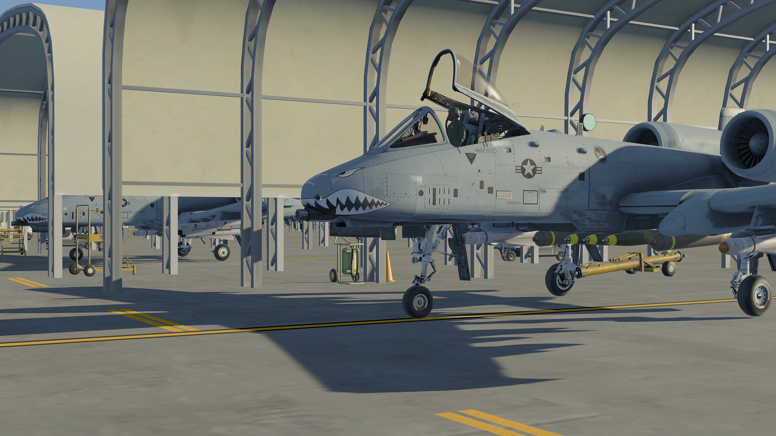 A10 Warthogs parked under canopies at an airforce base in Infinite Flight